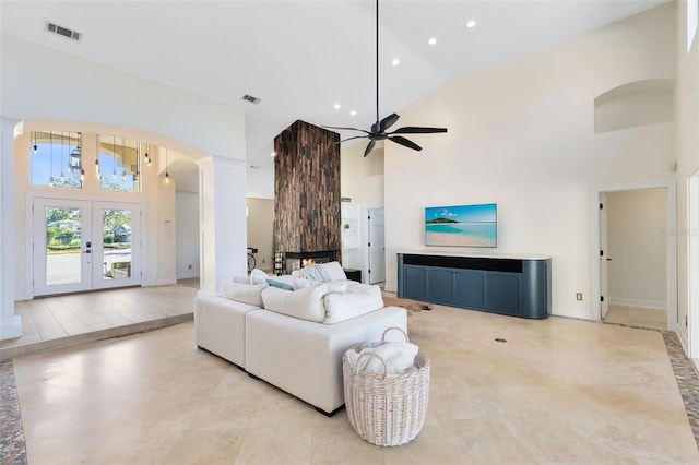 living room with french doors, high vaulted ceiling, and ceiling fan