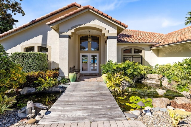 view of exterior entry with french doors