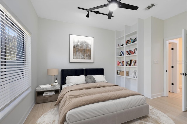 bedroom featuring ceiling fan and light hardwood / wood-style floors