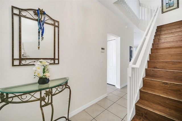 entryway with light tile patterned floors