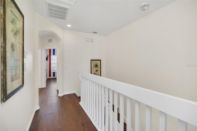 hallway with dark hardwood / wood-style flooring