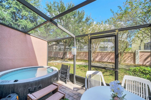 sunroom featuring a jacuzzi