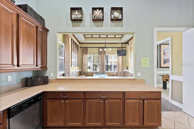 kitchen featuring dishwasher, kitchen peninsula, and light tile patterned floors