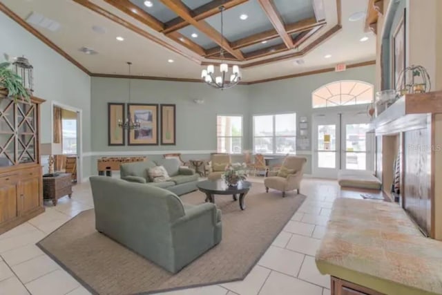 living room with a high ceiling, coffered ceiling, an inviting chandelier, and light tile patterned flooring