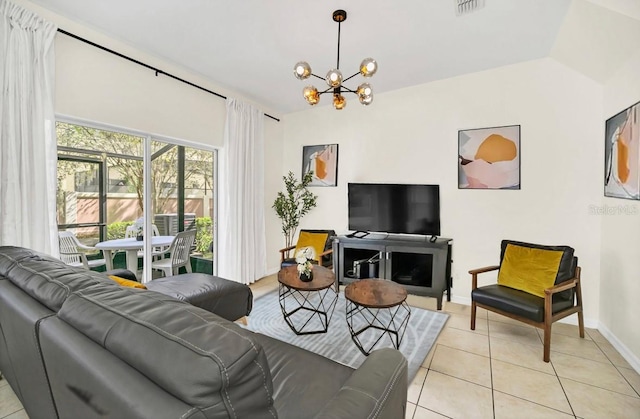 living room featuring lofted ceiling, an inviting chandelier, and light tile patterned floors