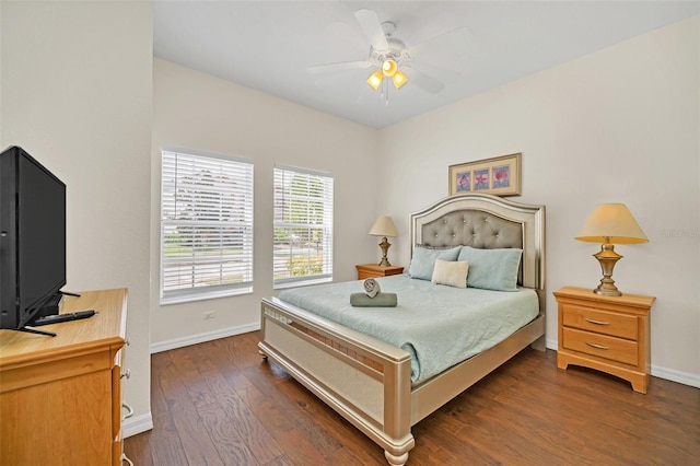 bedroom with ceiling fan and dark hardwood / wood-style floors