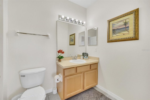 bathroom featuring vanity, tile patterned floors, and toilet