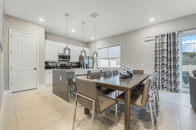 tiled dining area with a healthy amount of sunlight