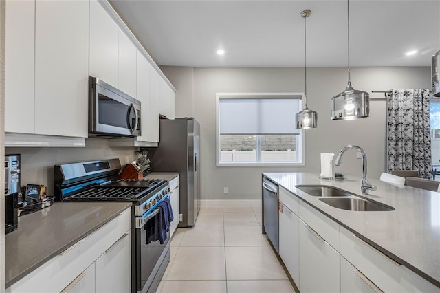 kitchen with white cabinetry, sink, and appliances with stainless steel finishes