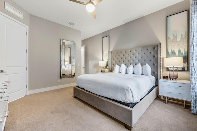 bedroom with light carpet and ceiling fan