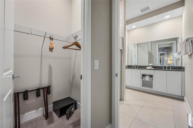 bathroom featuring tile patterned floors and vanity