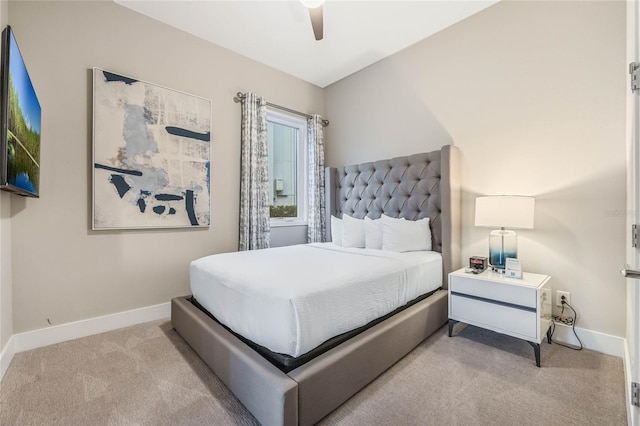 bedroom featuring ceiling fan and light carpet