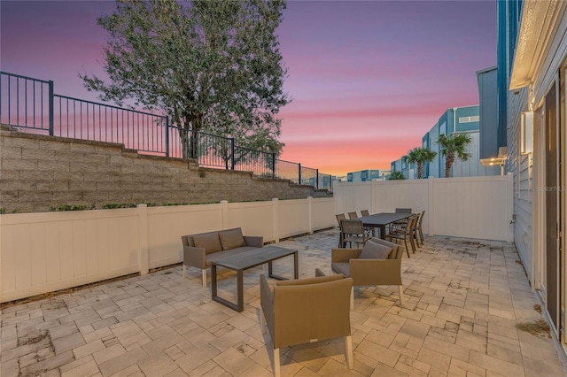 patio terrace at dusk with outdoor lounge area