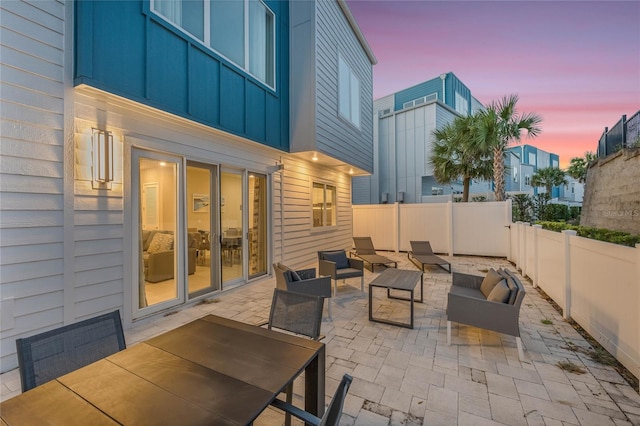 patio terrace at dusk with outdoor lounge area