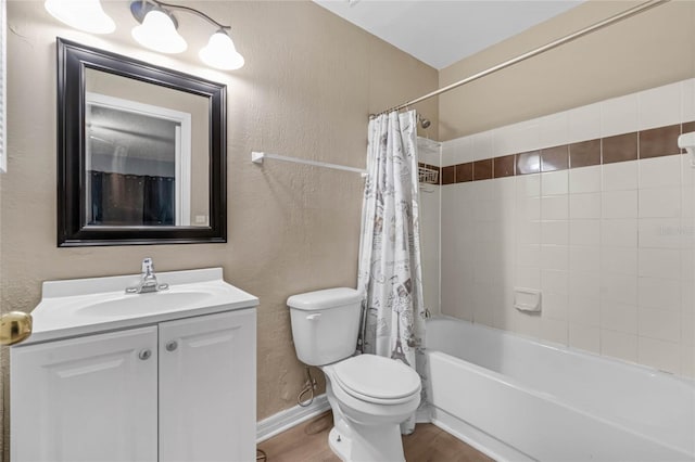 full bathroom with vanity, toilet, hardwood / wood-style flooring, and shower / tub combo with curtain