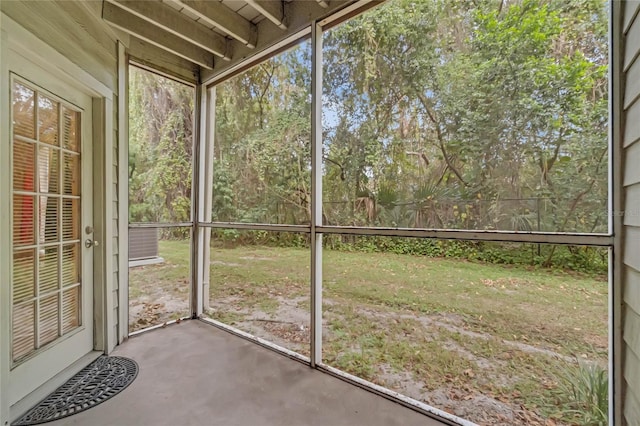 unfurnished sunroom featuring a healthy amount of sunlight