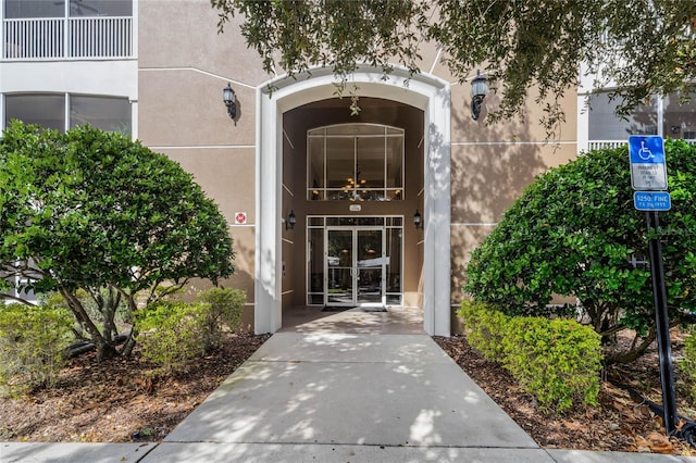3356 Robert Trent Jones Dr Unit 101, Orlando, FL 32835 - doorway to property featuring stucco siding