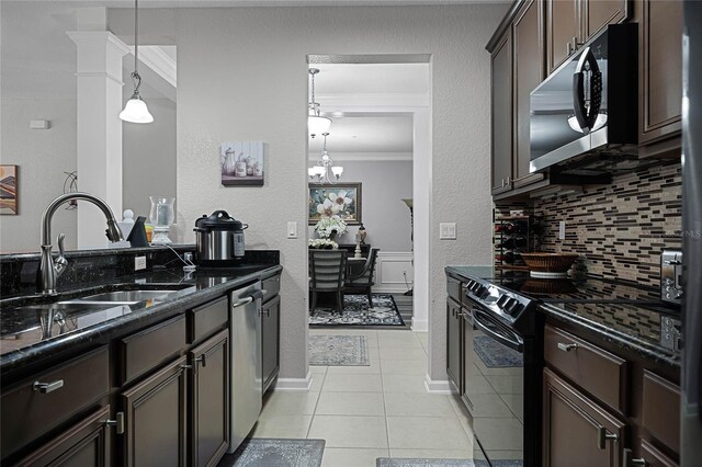 kitchen featuring stainless steel appliances, sink, crown molding, dark brown cabinetry, and light tile patterned floors