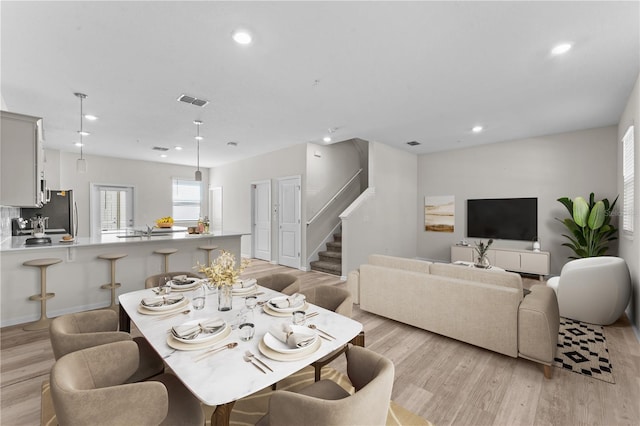 dining space featuring light hardwood / wood-style floors