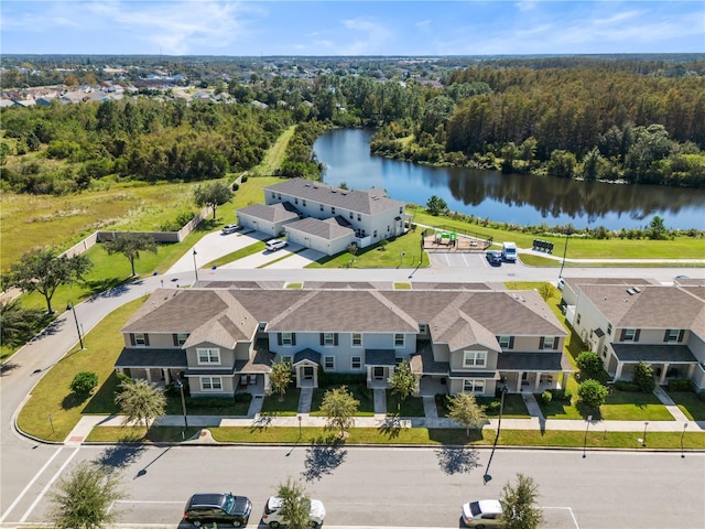 birds eye view of property with a water view