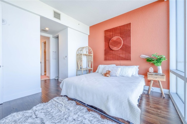 bedroom featuring dark hardwood / wood-style flooring