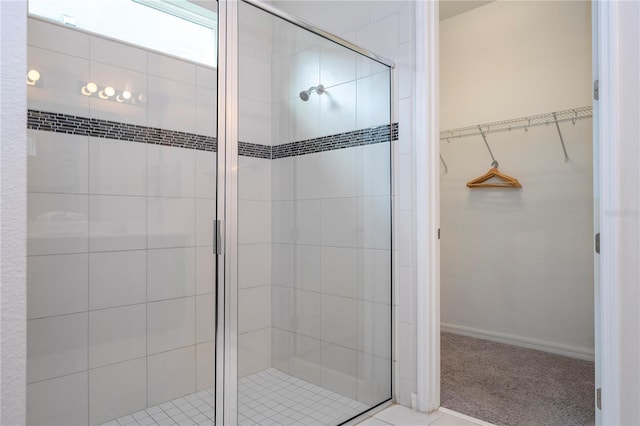 bathroom with a shower with shower door