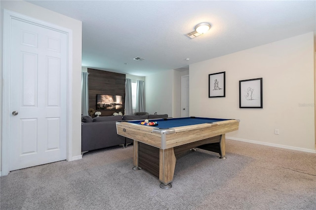 game room with pool table, a fireplace, and light colored carpet