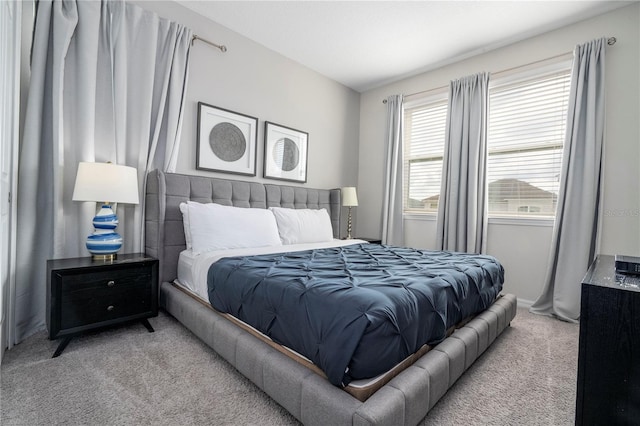 bedroom featuring light colored carpet