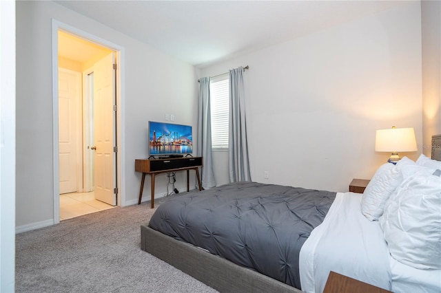 bedroom featuring light colored carpet