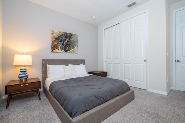 carpeted bedroom with a closet