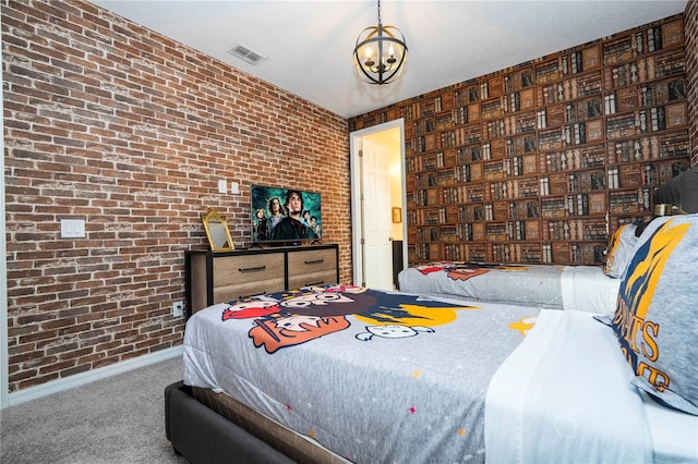 carpeted bedroom with brick wall and a chandelier