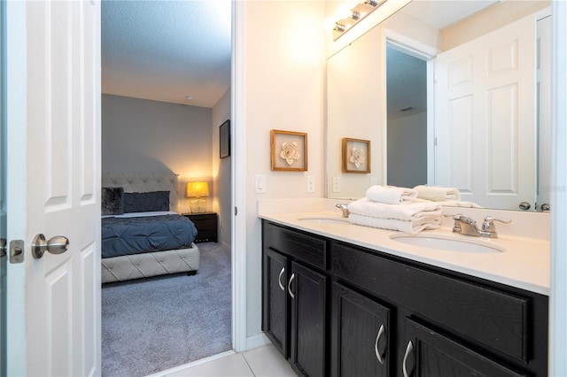 bathroom featuring vanity and a textured ceiling