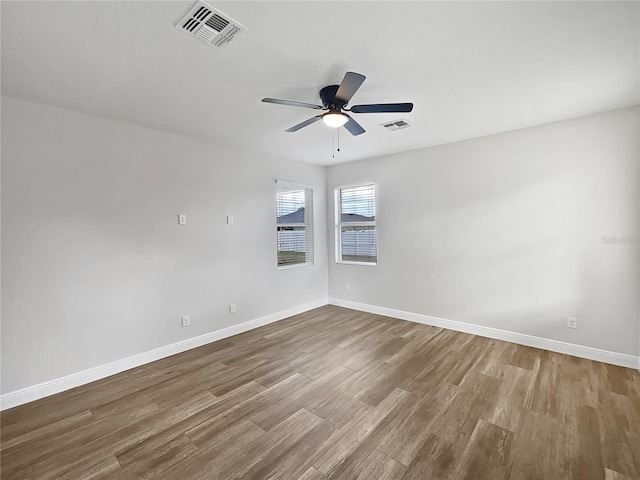 spare room featuring ceiling fan and wood-type flooring