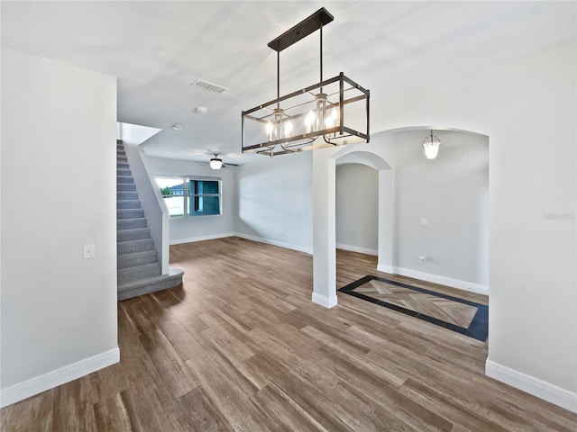 unfurnished dining area featuring ceiling fan and hardwood / wood-style floors