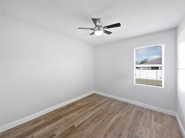 unfurnished room featuring ceiling fan and light hardwood / wood-style flooring