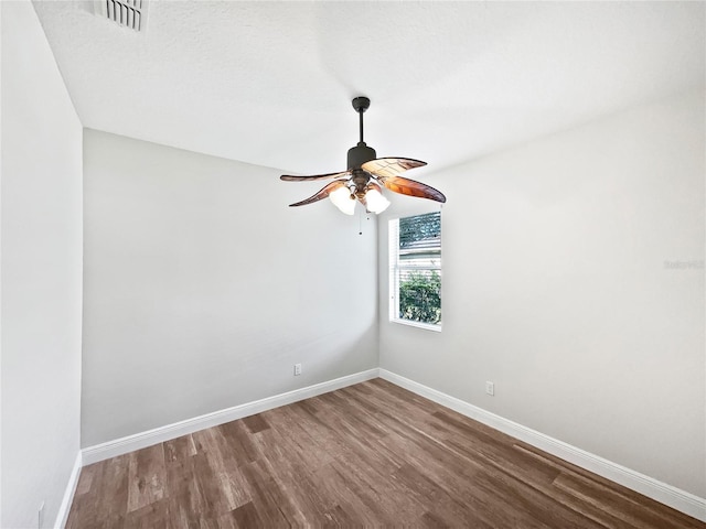 empty room featuring ceiling fan and hardwood / wood-style flooring