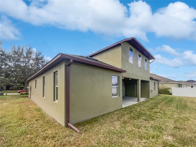 view of property exterior with a yard