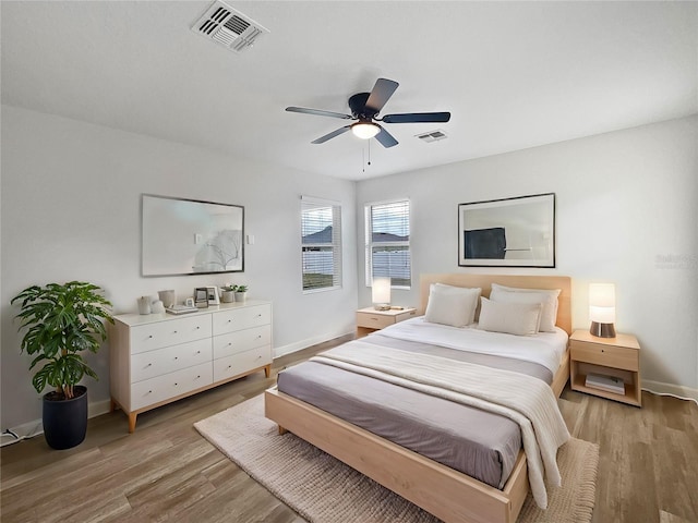 bedroom featuring hardwood / wood-style floors and ceiling fan