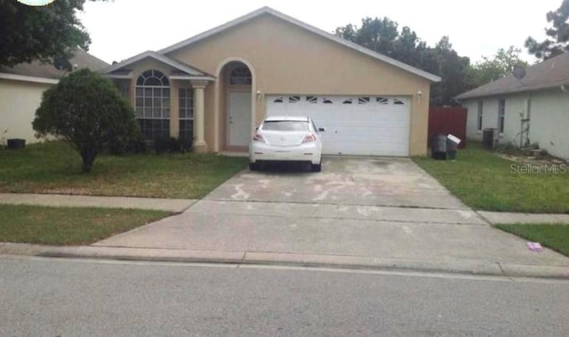 single story home with a front yard, a garage, and central air condition unit