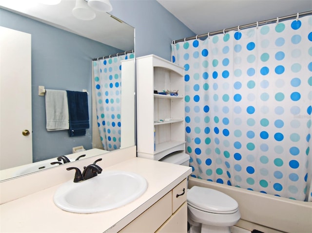 full bathroom featuring vanity, shower / tub combo with curtain, and toilet