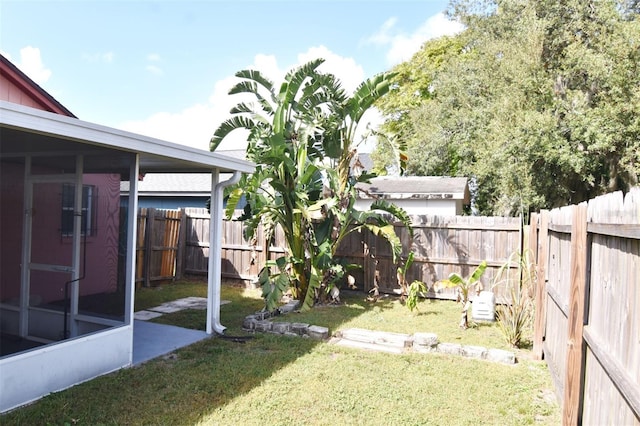 view of yard featuring a sunroom