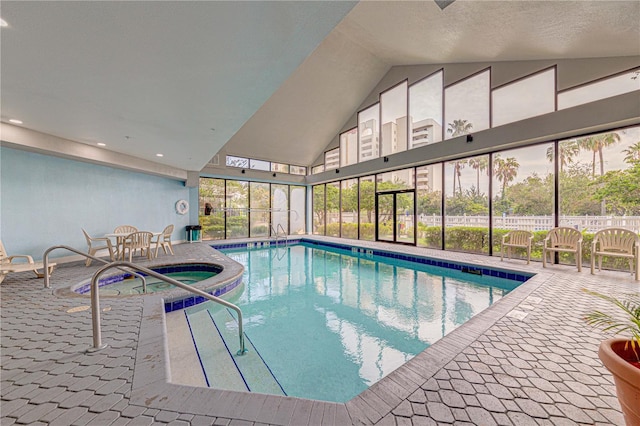 view of swimming pool with an indoor hot tub