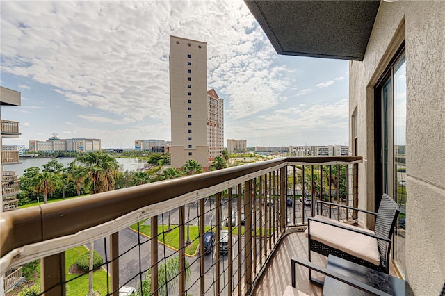 balcony featuring a water view