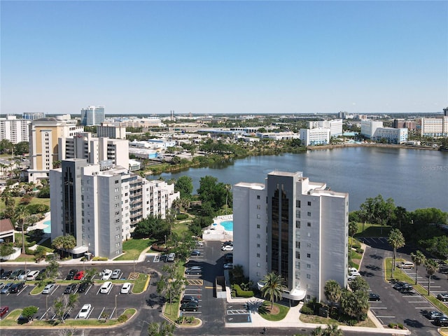 birds eye view of property featuring a water view and a city view