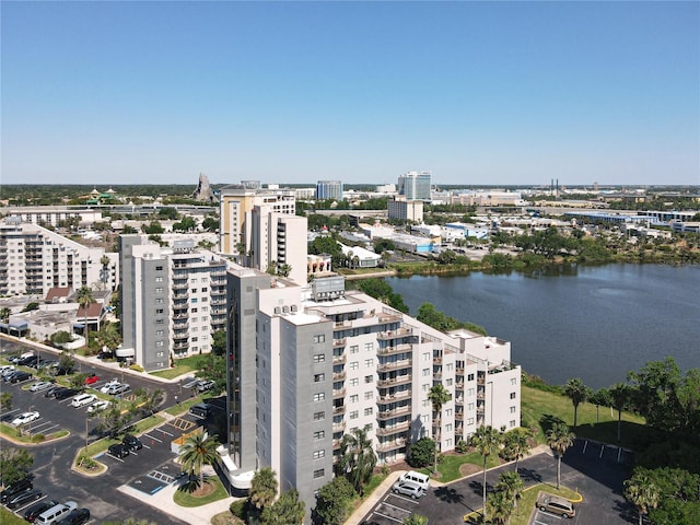 birds eye view of property featuring a view of city and a water view