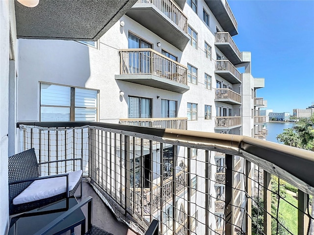 balcony featuring a water view