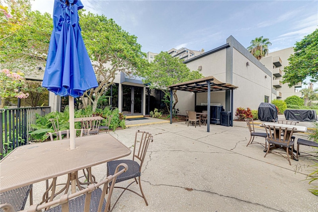 view of patio with outdoor dining space and french doors