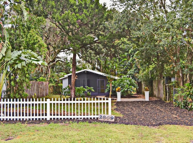 view of yard featuring a sunroom