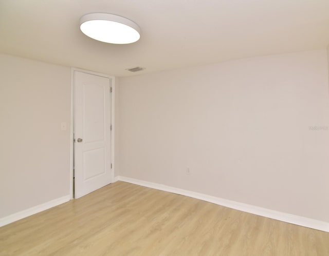 unfurnished room featuring light hardwood / wood-style floors