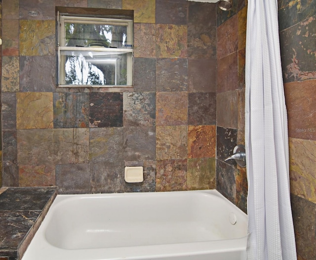 bathroom featuring shower / bath combination with curtain